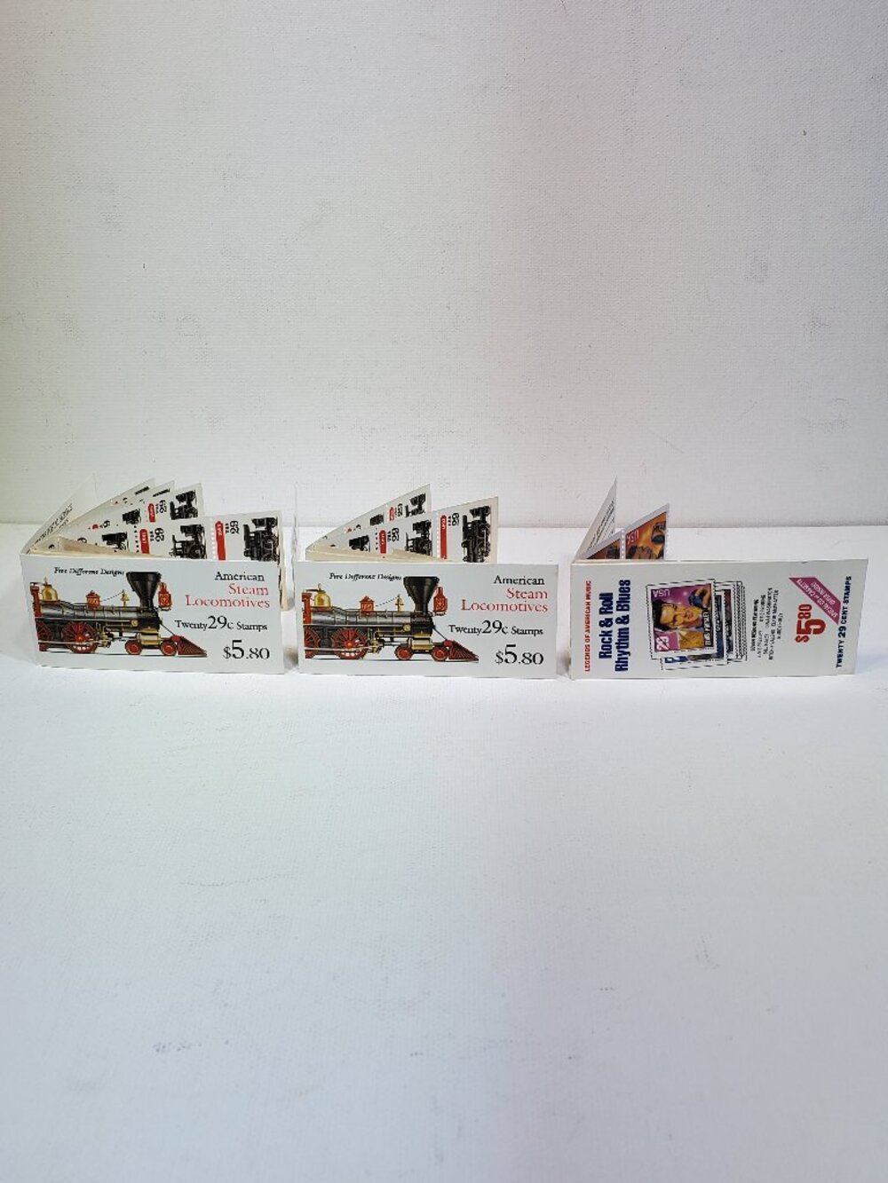 VINTAGE USPS 29 CENT LOCOMOTIVE AND ROCK & ROLL POSTAGE STAMPS...1992 & 1993